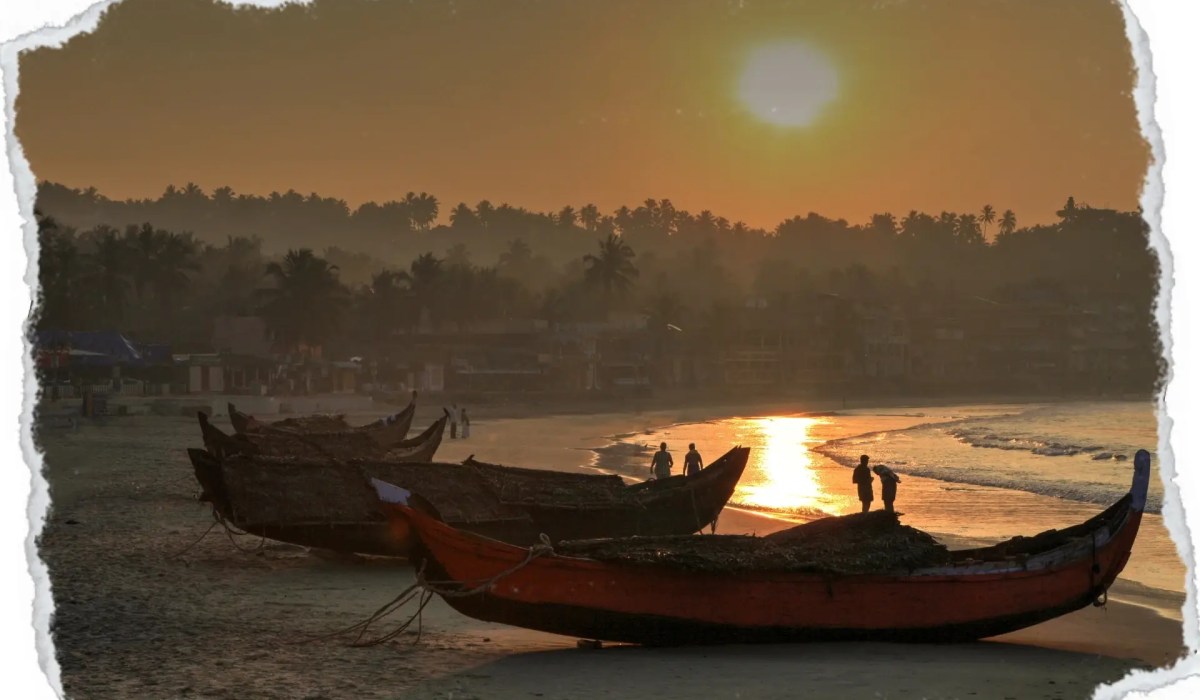 Kovalam beach and boats on a sunset