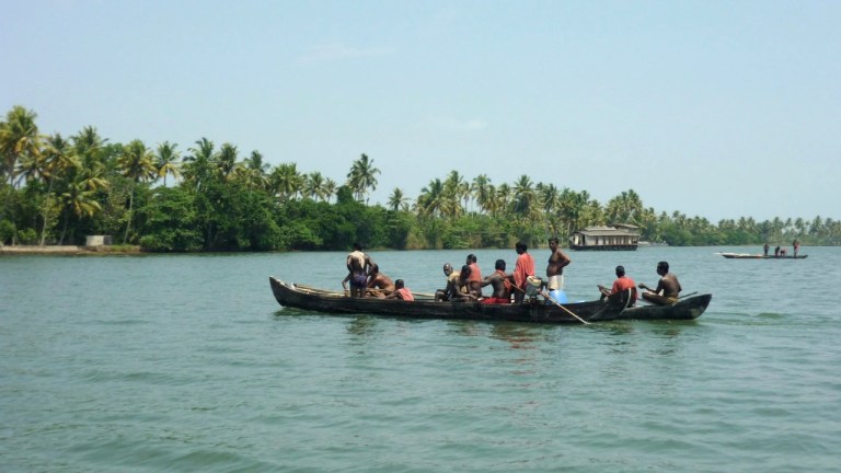 Local fishermen carrying out traditional fishing on Vembanad Lake, one of Kerala's largest and most biodiverse backwater ecosystems.